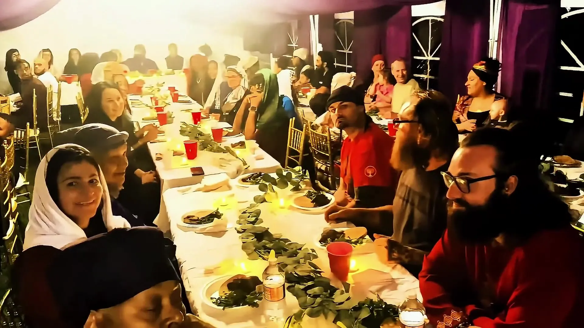The mishfaha gathered around a long candlelit table for the feast